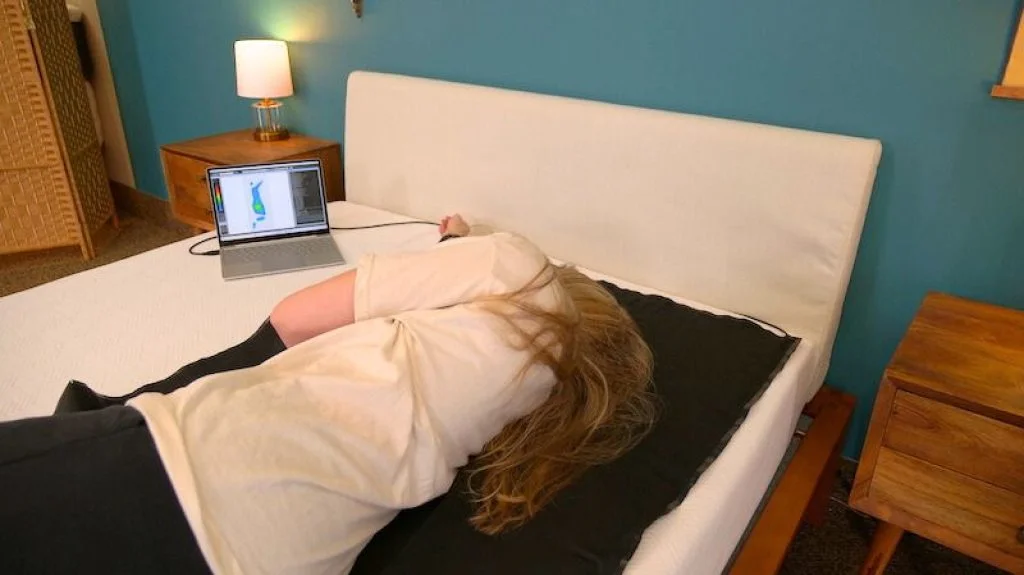 Casper Wave Hybrid Snow Mattress Review for 2026 5 Julia Forbes testing a mattress for pressure relief