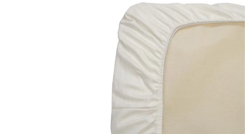 Our Review of Naturepedic Organic Cotton Sheets for 2026 4 how naturepedic cotton sheet fits on a mattress