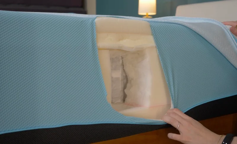 Julia Forbes, our lead product tester, cutting open the Tempur-Pro-Breeze mattress