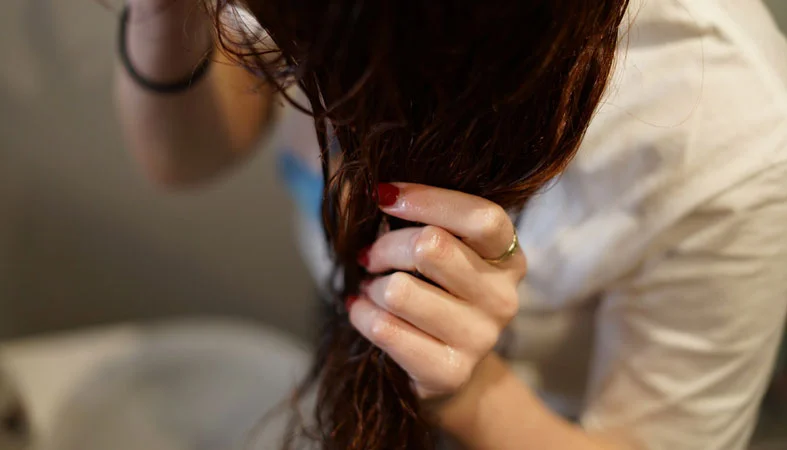 How To Prevent Bed Head - Tips and Tricks 3 woman takes care of her hair