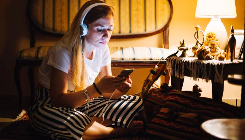 woman is listening music at night