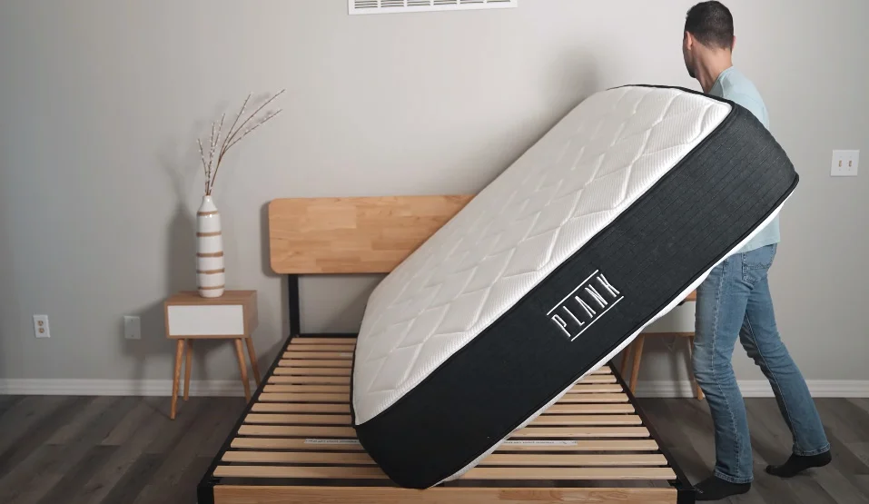 Best Mattress for People with a Herniated Disc - Medically Reviewed 134 Stuart is flipping Plank Firm Luxe mattress