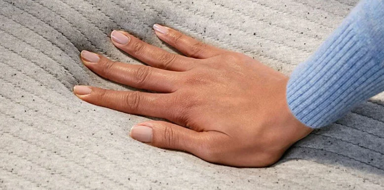 Our In-Depth Casper Hybrid Mattress Review for 2026 7 the hand is squishing casper original hybrid